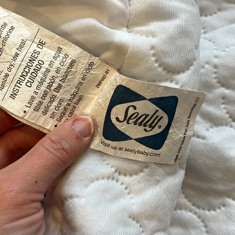 Infant crib mattress cover Sealy